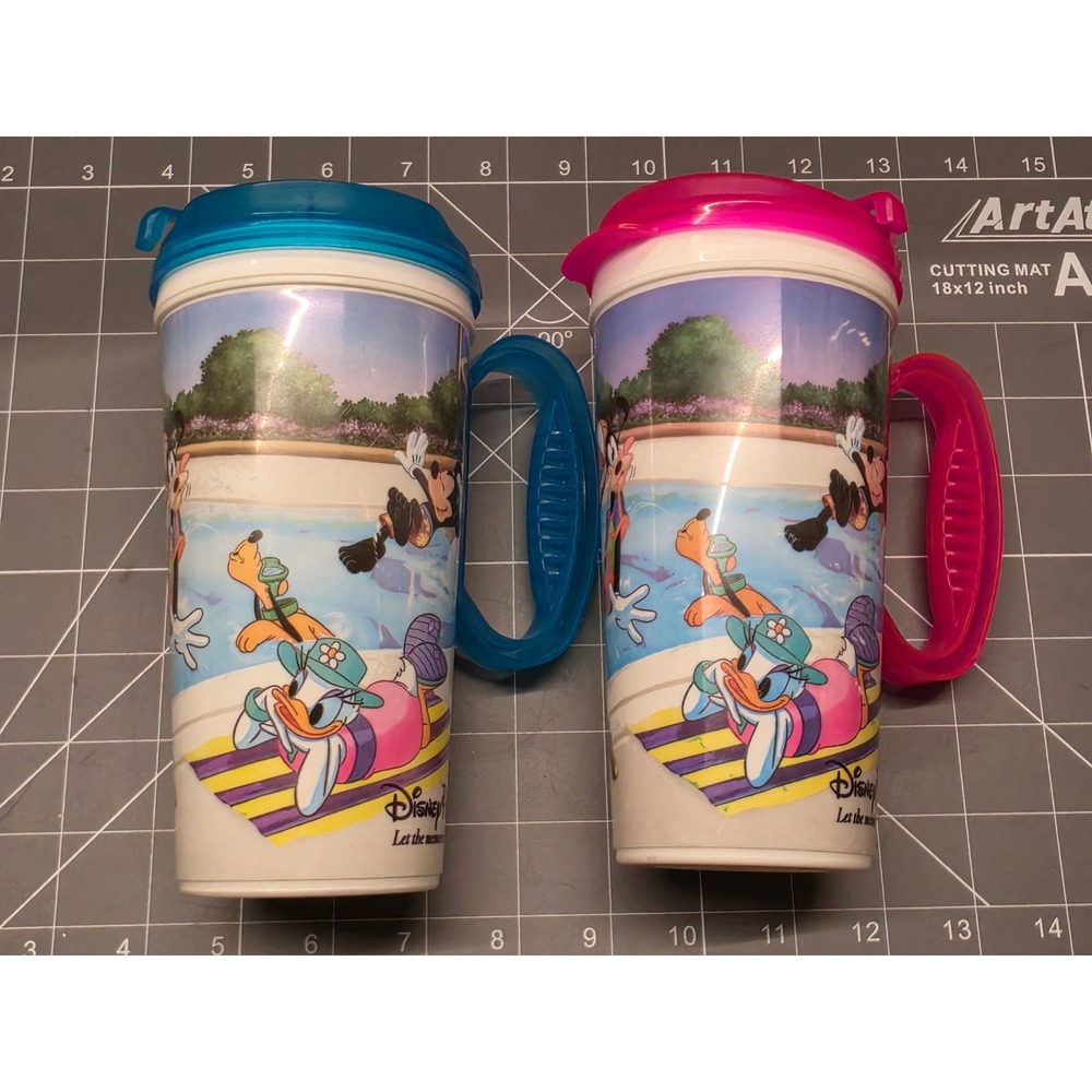 Disney Parks "Let the Memories Begin" Refillable Travel Mugs. 2011